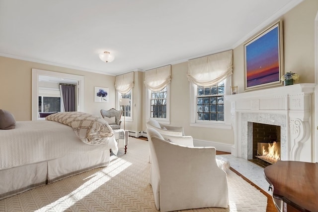 bedroom with crown molding and a premium fireplace