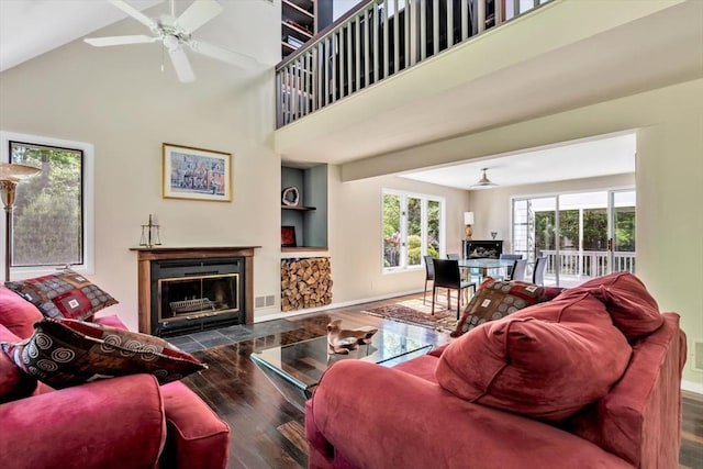 17 Claus, Barnstable, MA 02648 - living area with wood finished floors, a high ceiling, a ceiling fan, a fireplace with flush hearth, and baseboards