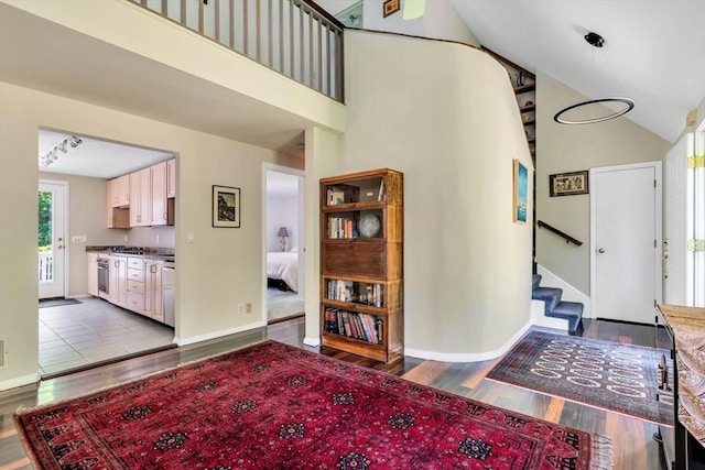 17 Claus, Barnstable, MA 02648 - entrance foyer featuring dark wood finished floors, stairs, a towering ceiling, and baseboards