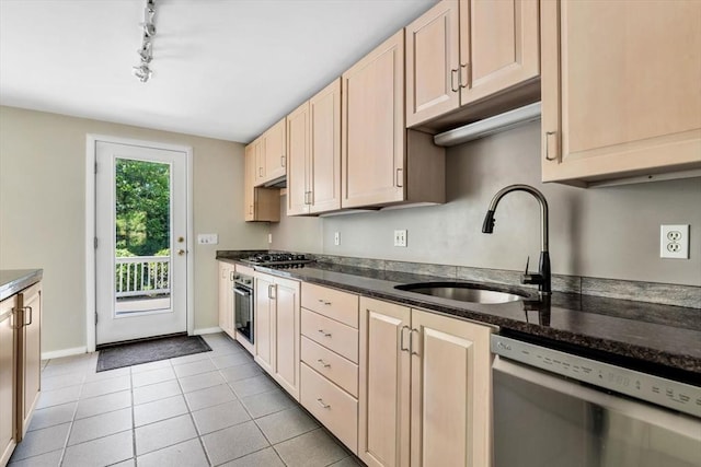 17 Claus, Barnstable, MA 02648 - kitchen featuring stainless steel appliances, rail lighting, baseboards, a sink, and light tile patterned floors
