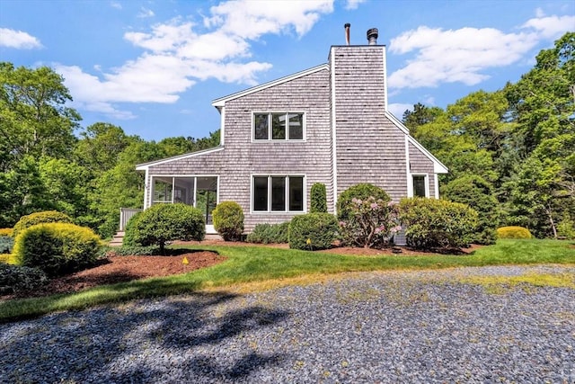 17 Claus, Barnstable, MA 02648 - view of property exterior with a sunroom and a chimney