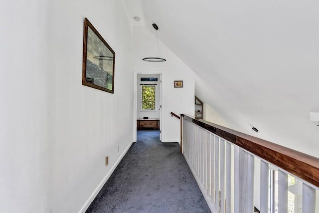 17 Claus, Barnstable, MA 02648 - corridor with lofted ceiling, dark colored carpet, and baseboards