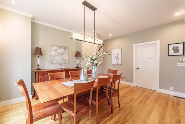 dining space with recessed lighting, baseboards, and light wood-type flooring