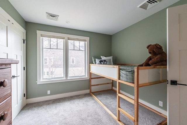 bedroom with visible vents, carpet, and baseboards