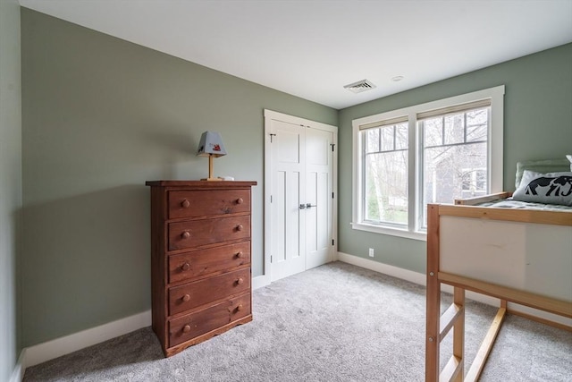 bedroom with carpet flooring, baseboards, and visible vents