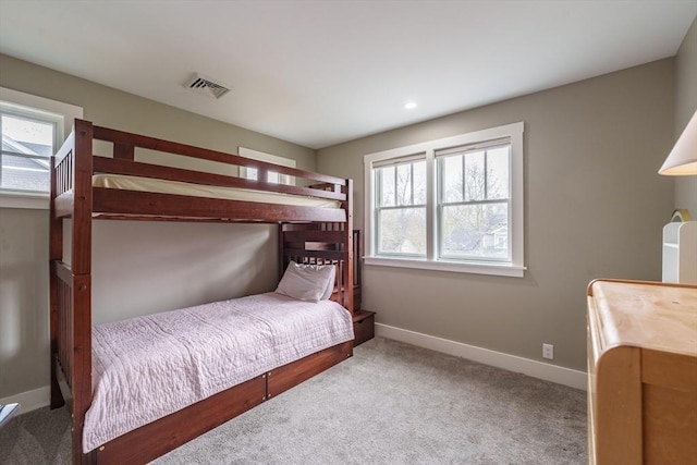 carpeted bedroom featuring visible vents, recessed lighting, and baseboards