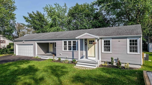 11 Rose Ave, Westport, MA 02790 - ranch-style house with an attached garage, driveway, a front lawn, and roof with shingles