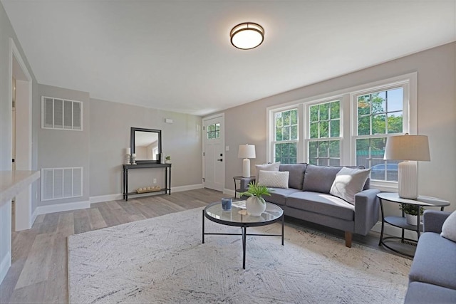 11 Rose Ave, Westport, MA 02790 - living area featuring wood finished floors and plenty of natural light