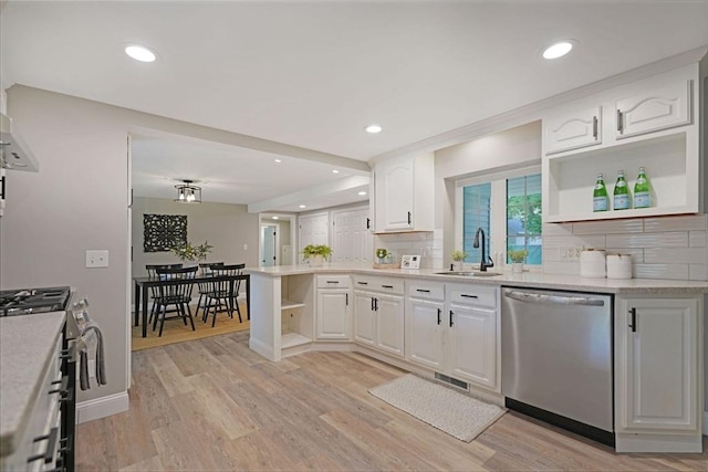 11 Rose Ave, Westport, MA 02790 - kitchen featuring appliances with stainless steel finishes, open shelves, backsplash, light wood-style floors, and recessed lighting