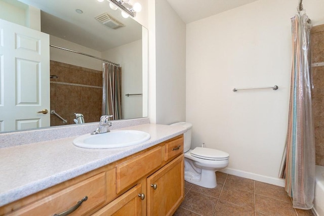 full bathroom with tile patterned floors, vanity, toilet, and shower / tub combo