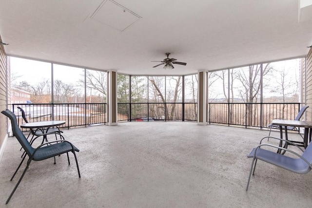 sunroom featuring ceiling fan