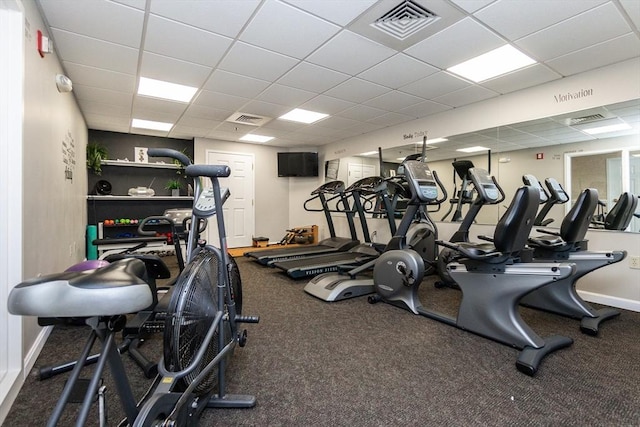 gym featuring a drop ceiling