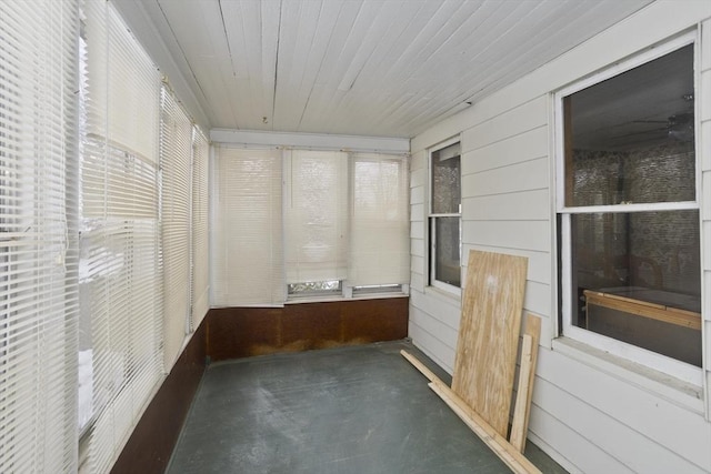 unfurnished sunroom featuring wooden ceiling