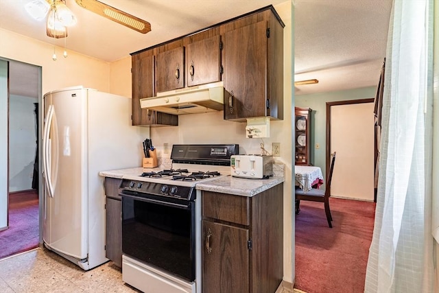 kitchen featuring ceiling fan and white appliances