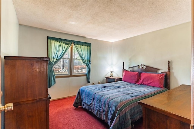 bedroom with carpet flooring and a textured ceiling