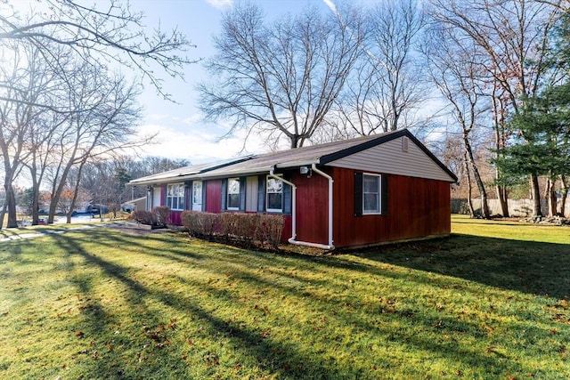 view of property exterior with a lawn