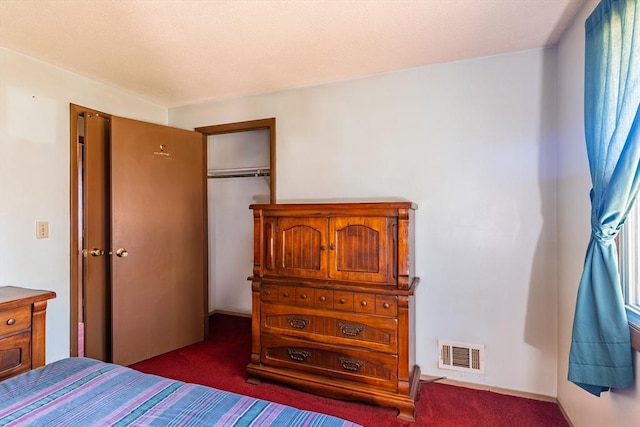 carpeted bedroom featuring a closet