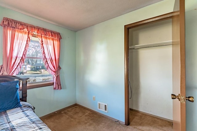 unfurnished bedroom with a closet and carpet