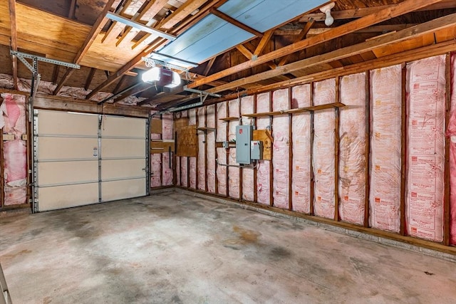 garage featuring electric panel and a garage door opener