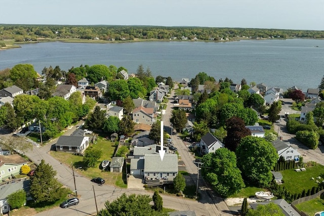 aerial view of residential area featuring a nearby body of water