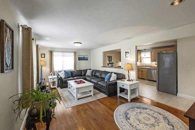 living room featuring light wood-style flooring