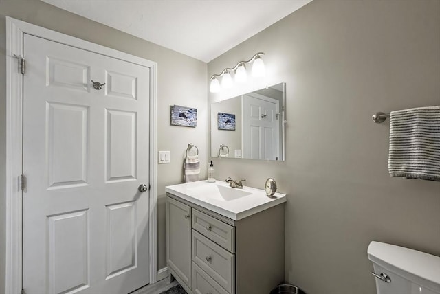 half bath with toilet and vanity