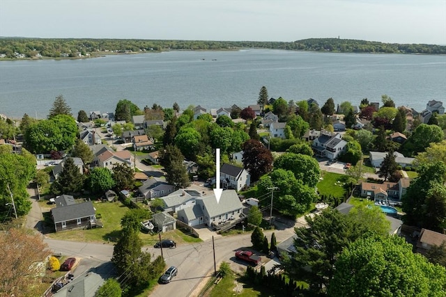 aerial perspective of suburban area featuring a nearby body of water