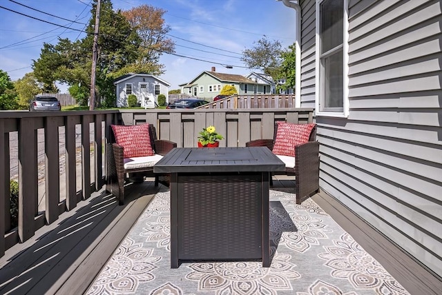 wooden terrace with a residential view