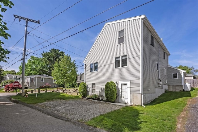 view of side of property featuring a yard