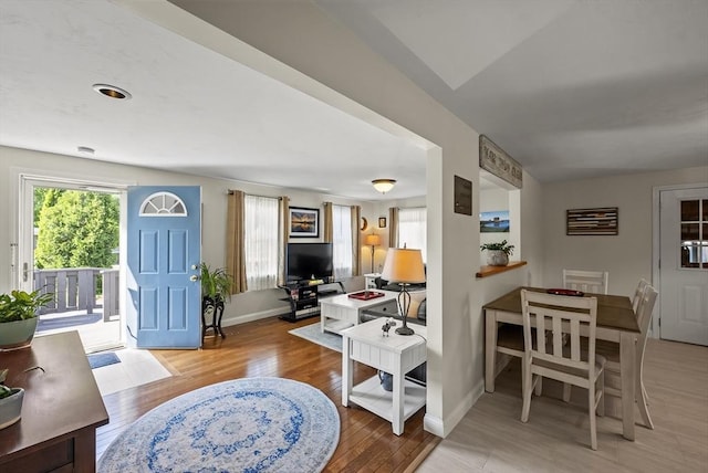 foyer entrance featuring wood finished floors and baseboards