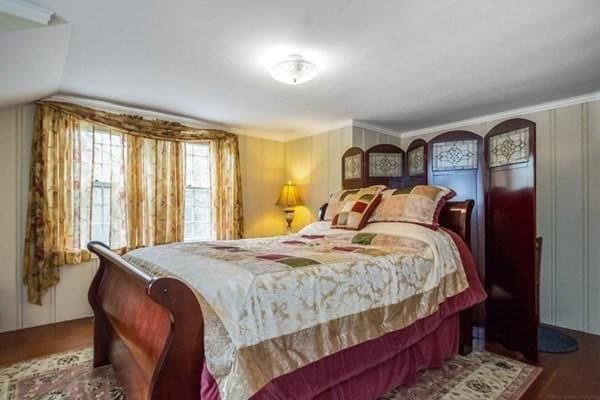bedroom with wood finished floors