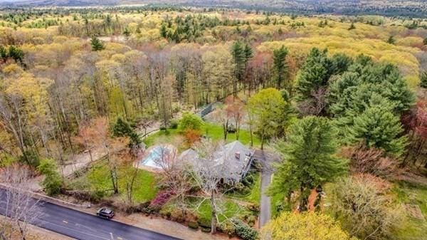 birds eye view of property with a forest view