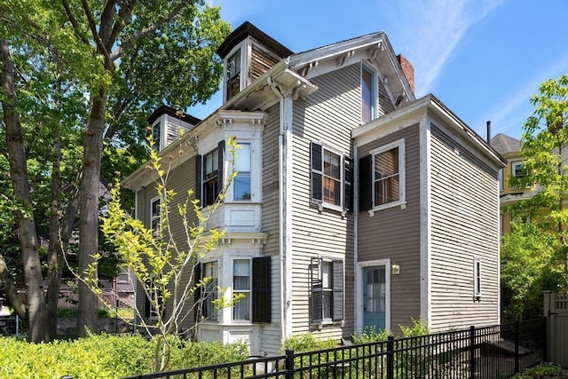 31 Boylston St, Boston, MA 02130 - view of home's exterior with a chimney