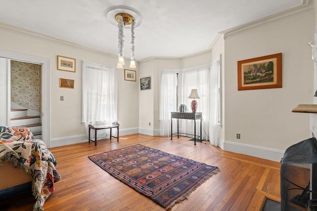 31 Boylston St, Boston, MA 02130 - living area featuring light wood-type flooring, baseboards, crown molding, and stairs