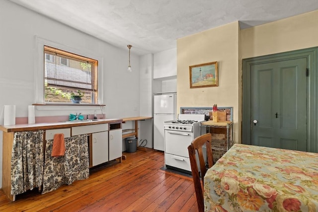 31 Boylston St, Boston, MA 02130 - kitchen with white appliances, hardwood / wood-style floors, and a sink