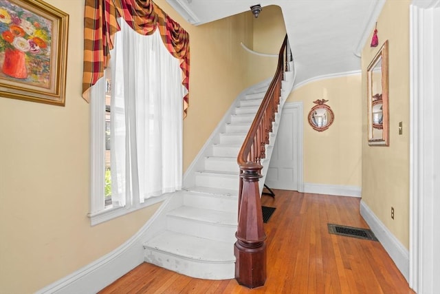 31 Boylston St, Boston, MA 02130 - staircase with wood-type flooring and baseboards
