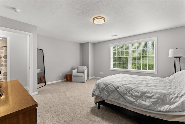 48 Finch Rd Unit 2, Raynham, MA 02767 - carpeted bedroom featuring a textured ceiling and baseboards