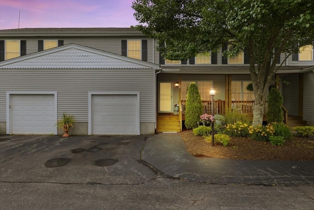 48 Finch Rd Unit 2, Raynham, MA 02767 - townhome / multi-family property featuring driveway, an attached garage, and covered porch
