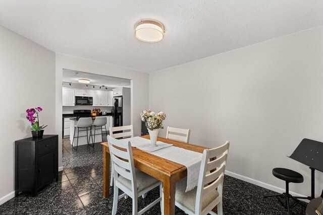 48 Finch Rd Unit 2, Raynham, MA 02767 - dining room featuring baseboards and granite tiled floors