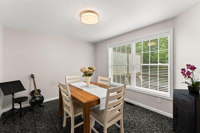 48 Finch Rd Unit 2, Raynham, MA 02767 - dining area with baseboards and dark flooring