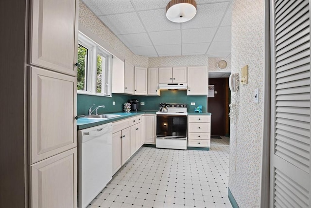 8A 3rd St, Medford, MA 02155 - kitchen featuring white appliances, under cabinet range hood, a drop ceiling, wallpapered walls, and light flooring