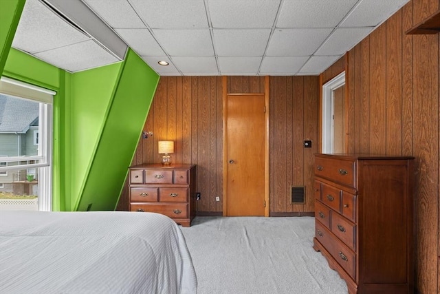 8A 3rd St, Medford, MA 02155 - carpeted bedroom featuring wood walls and a drop ceiling