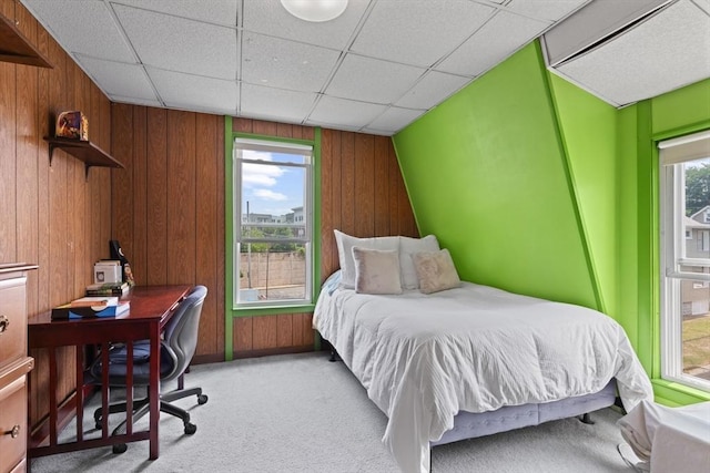 8A 3rd St, Medford, MA 02155 - carpeted bedroom with multiple windows, a desk, wooden walls, and a drop ceiling