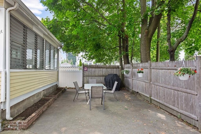8A 3rd St, Medford, MA 02155 - fenced backyard with outdoor dining area, a patio area, and area for grilling