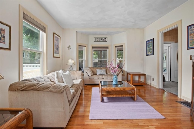 8A 3rd St, Medford, MA 02155 - living room featuring light wood-type flooring and baseboards