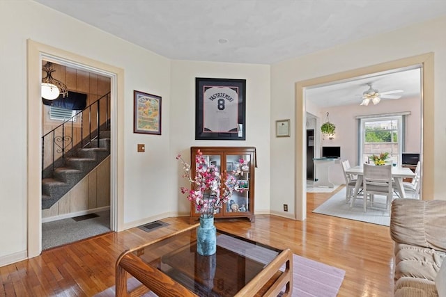 8A 3rd St, Medford, MA 02155 - living area with wood finished floors, stairway, and ceiling fan