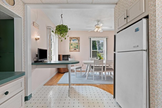8A 3rd St, Medford, MA 02155 - kitchen featuring freestanding refrigerator, a ceiling fan, and light flooring