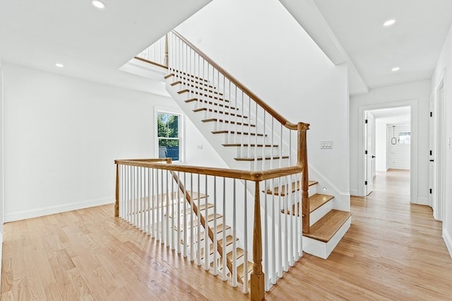 stairway featuring hardwood / wood-style flooring