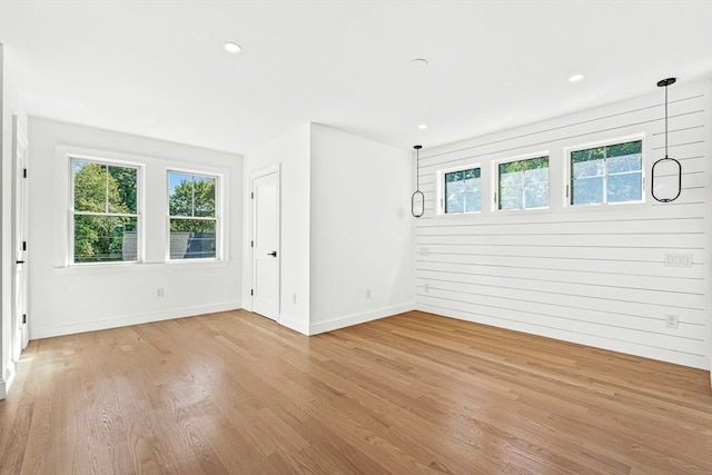 empty room with hardwood / wood-style floors