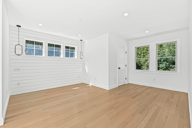 spare room with wood-type flooring